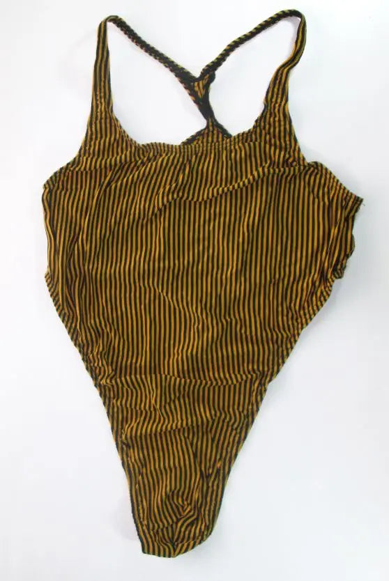 yellow and black stripe thong bodysuit flat lay, sporty cut, high-leg design, sleek stretch fabric – pridevoyageshop.com – gay men’s harness, lingerie and fetish wear