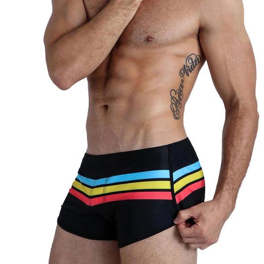 sexy gay man in black Gay Swimwear & Beachwear | Men's Pride Stripe Swim Trunks - pridevoyageshop.com - gay men’s underwear and swimwear