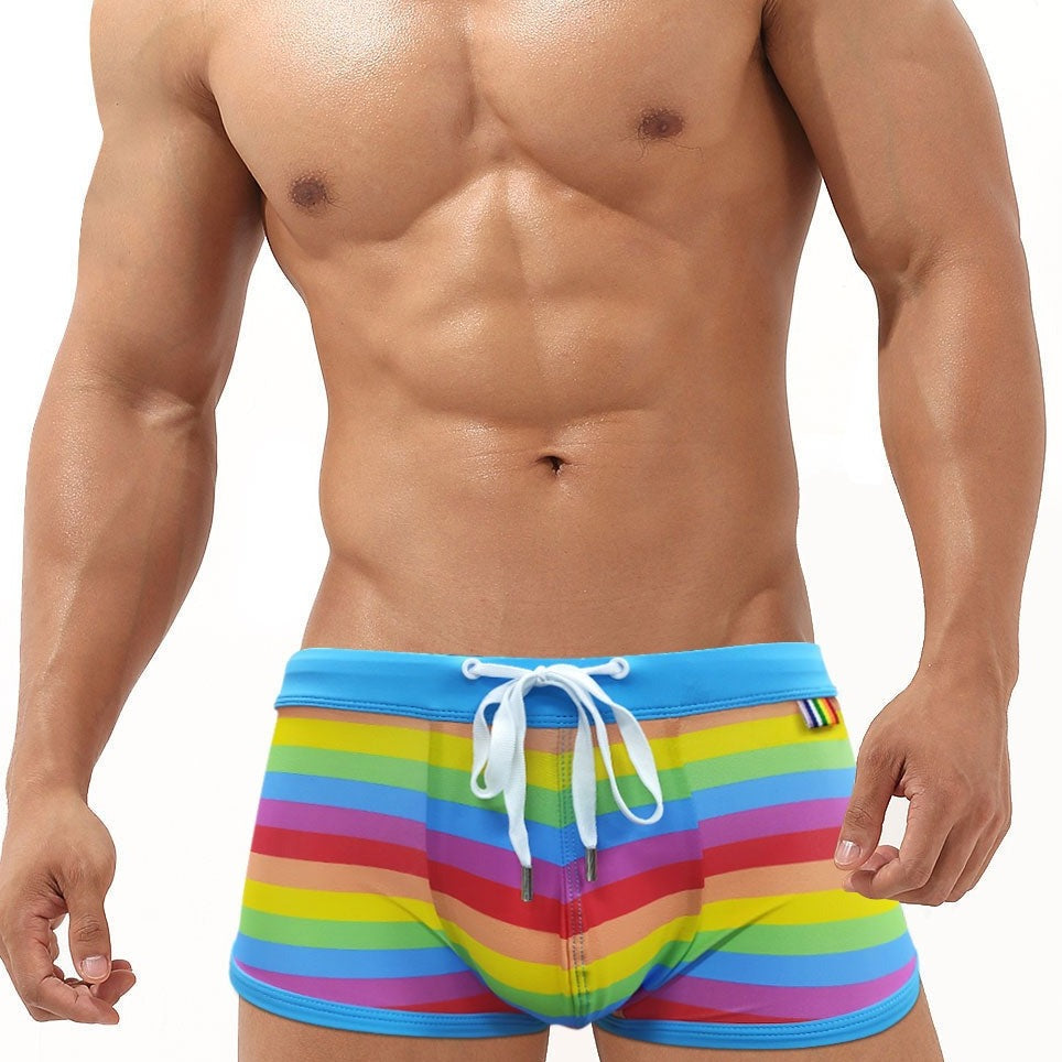 hot gay man in Gay Swimwear | Gay Men's Rainbow Drawstring Swim Trunks - pridevoyageshop.com - gay men’s underwear and swimwear